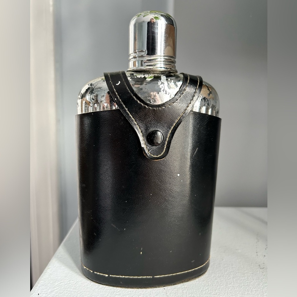 Vintage flask with leather holder